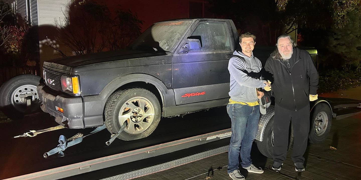 Jake Rowe poses in front of his new GMC Syclone with George Bowman, its former owner