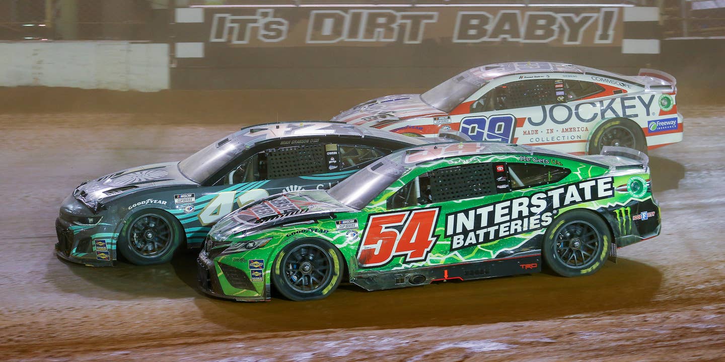 BRISTOL, TN - APRIL 09: NASCAR Cup Series driver Ty Gibbs (54), NASCAR Cup Series driver Noah Gragson (42), and NASCAR Cup Series driver Daniel Suarez (99) enter the third turn three wide during the Food City Dirt Race on April 9, 2023 at Bristol Motor Speedway in Bristol, TN. (Photo by Chris McDill/Icon Sportswire via Getty Images)