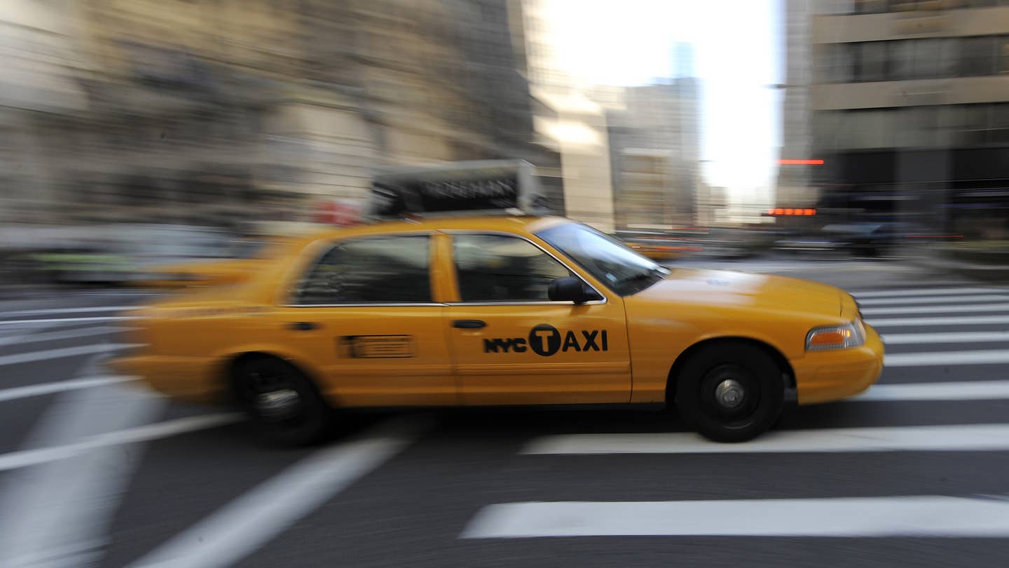A New York City taxi passes through